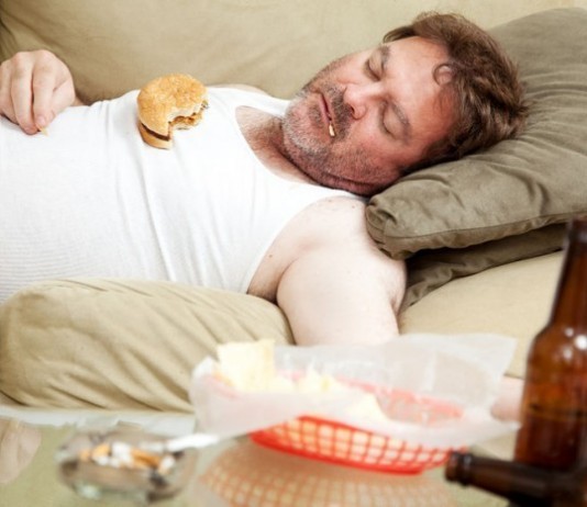 Hospital Merges with Fast Food, Tobacco Companies to ‘Stay Competitive’ man eating and smoking