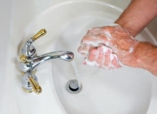 Man Thoroughly Washing Hands in Bathroom After Urination, Concerning
