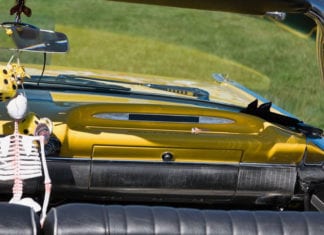 Breaking News: 10 Bucks Says an Orthopod Drives This Car with a Skeleton Hanging from the Rearview Mirror skeleton rearview mirror