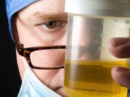 New Intern Hands Attending Cup of Urine on Rounds