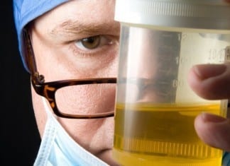 New Intern Hands Attending Cup of Urine on Rounds