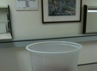 Hospital Staff Deciding If Cup at Nurses Station is Filled With Urine-Colored Tea or Tea-Colored Urine urine sample