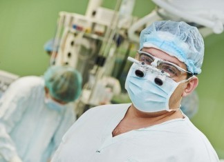 Surgeons to operate 6 feet away from patient in operating room surgeon operating