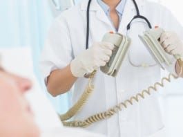 Hospitalist Administering CPR Interrupted With STAT Coding Query paddles for defibrillation