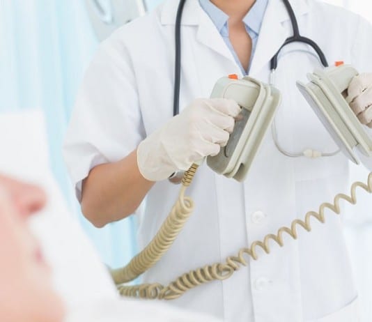 Hospitalist Administering CPR Interrupted With STAT Coding Query paddles for defibrillation