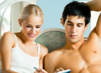 Hospital Administrator Gives Partner Post-Coital Satisfaction Survey Out Of Habit couple in bed filling out survey