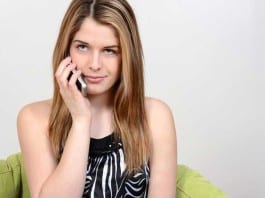 Doctor Calls Patient in Clinic to Get Her Off the Phone woman on phone at doctor's office