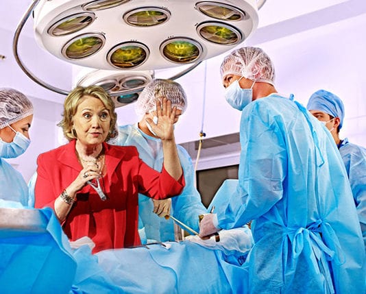 Dr. Clinton Gets Away with Wearing Pantsuit in OR