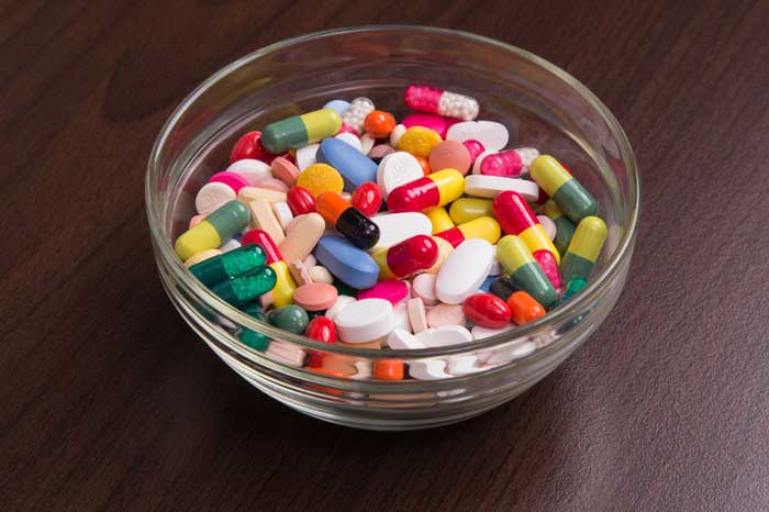 Glass Candy Bowl Filled with Assortment of Antibiotics, Steroids, and Narcotics Available at ER Triage Desk