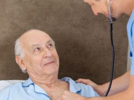 As Nurse Leans In for a Listen, Patient Can Think of No Better Time to Start Coughing Violently coughing