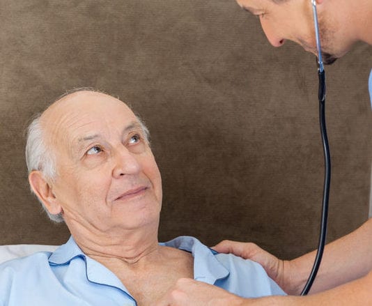 As Nurse Leans In for a Listen, Patient Can Think of No Better Time to Start Coughing Violently coughing